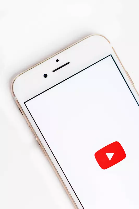 Photo on mobile phone showing the YouTube logo
