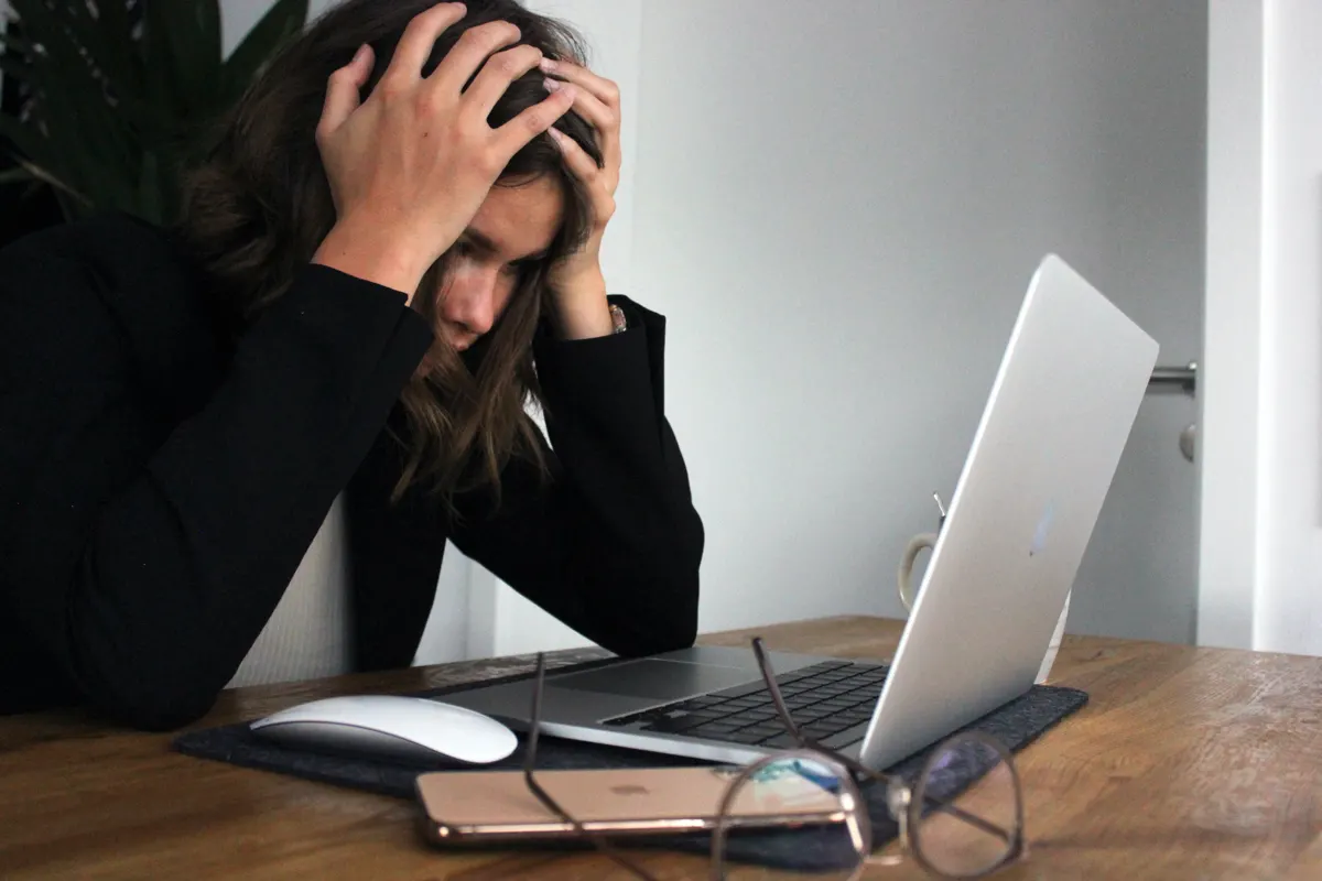 Upset person in front of computer
