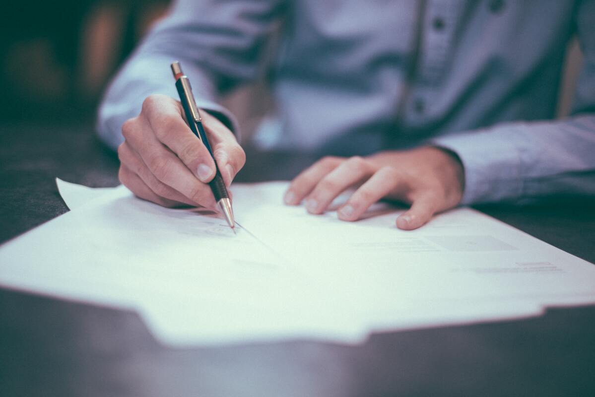 Man drafting an invoice