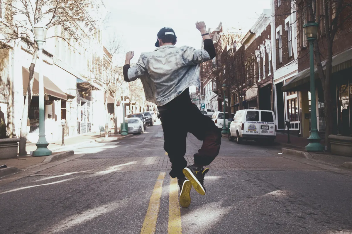 man jumping happily