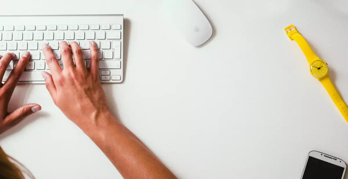 Person working in front of the computer and typing